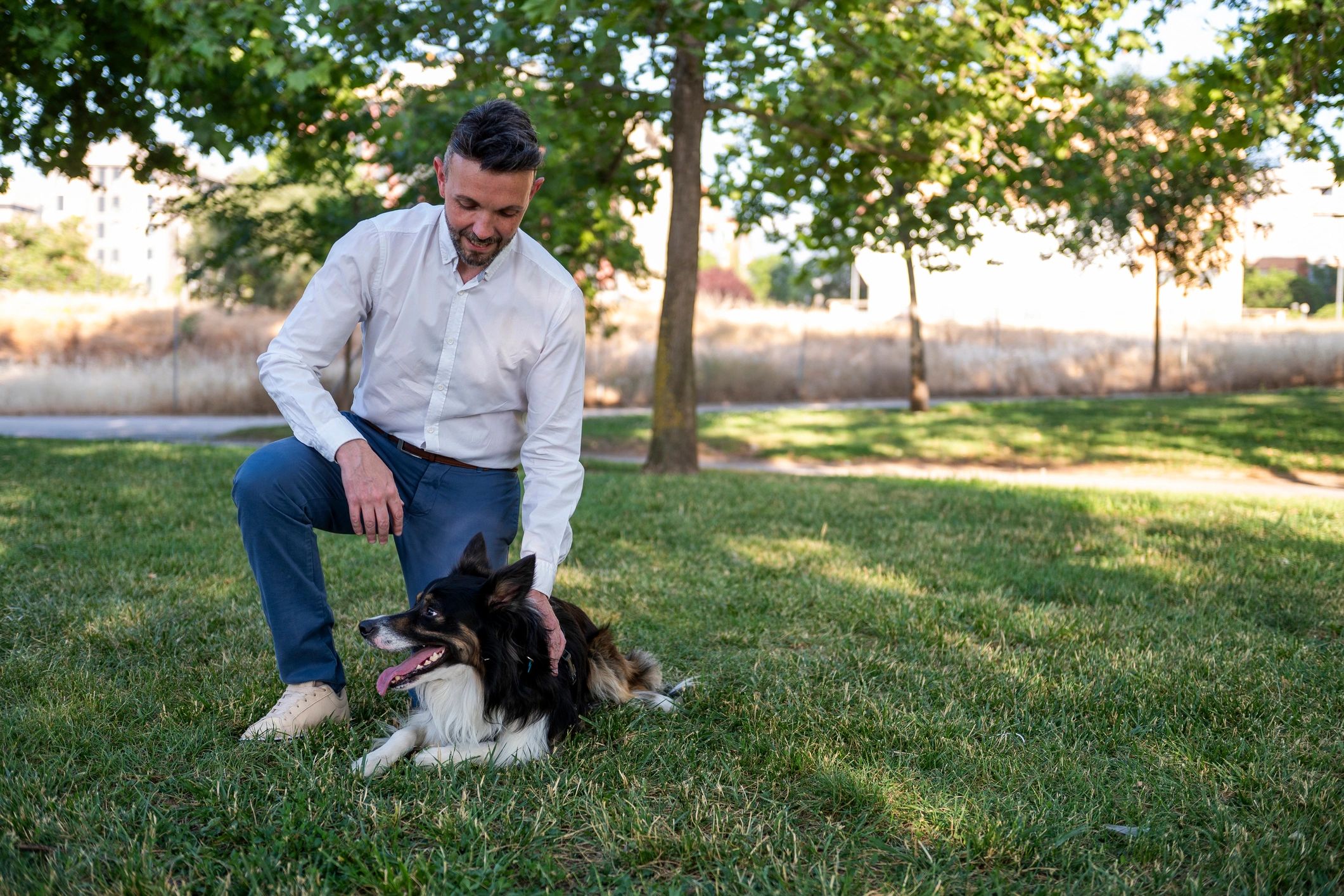 Pet owner with dog outdoors
